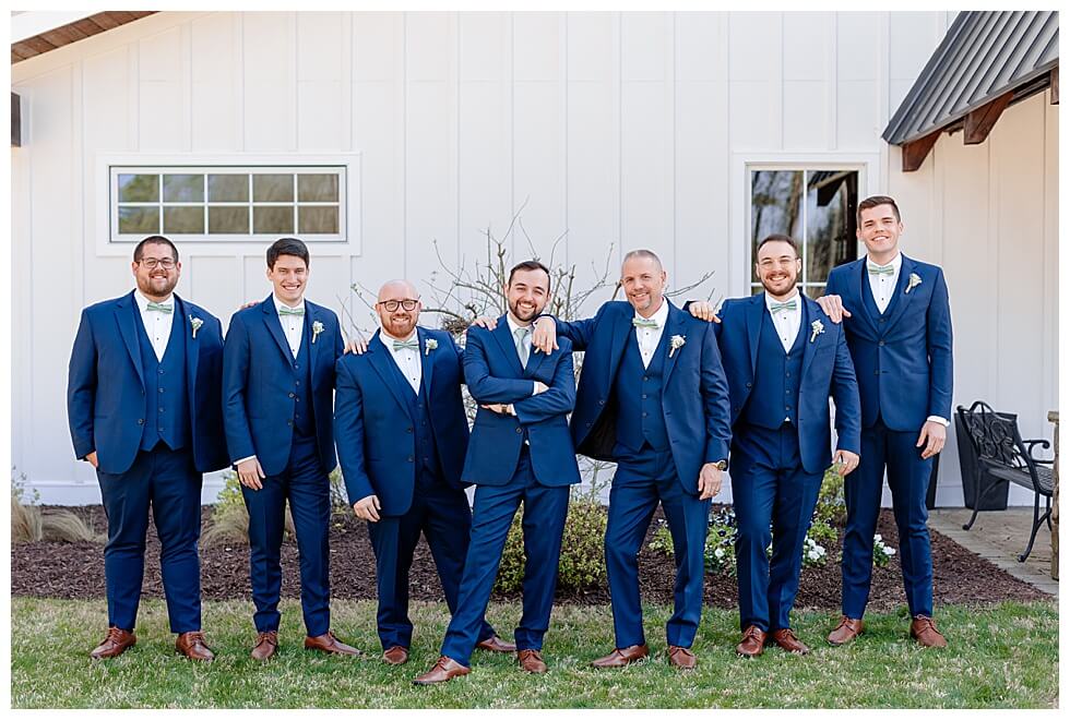 Groomsmen taking photos at The Pavilion At Carriage Farm