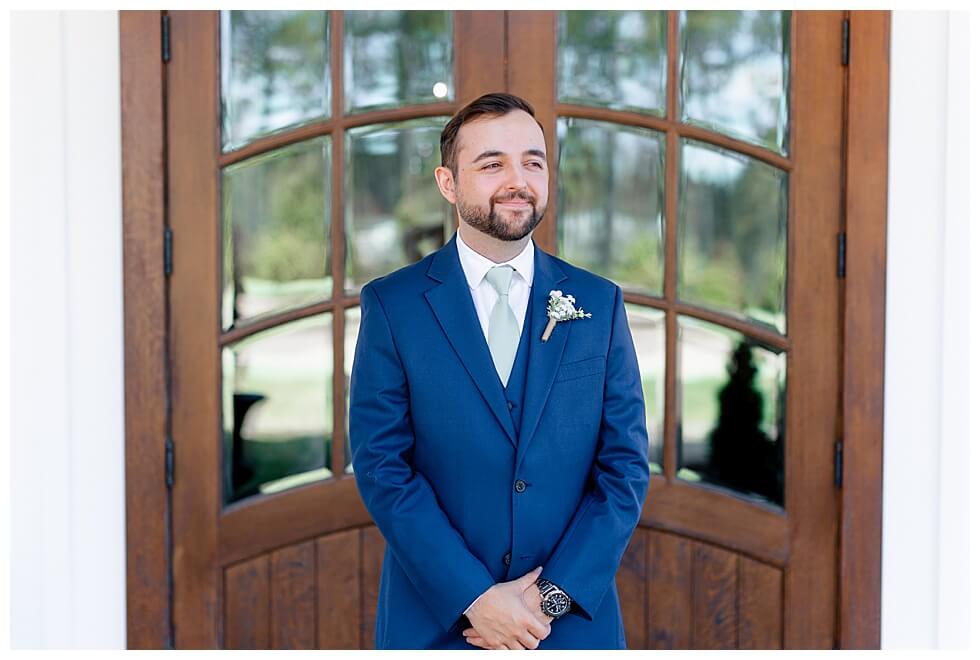 Groom Taking Portriats at The Pavilion At Carriage Farm