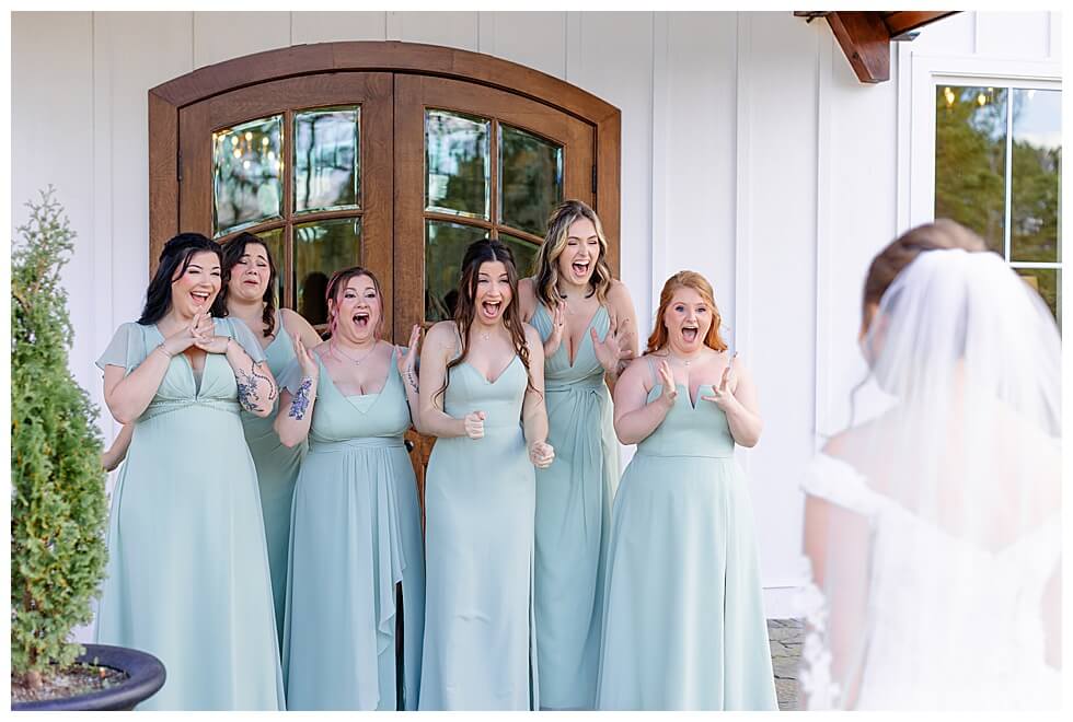 Bride Having First Look With Bridesmaids at The Pavilion At Carriage Farm