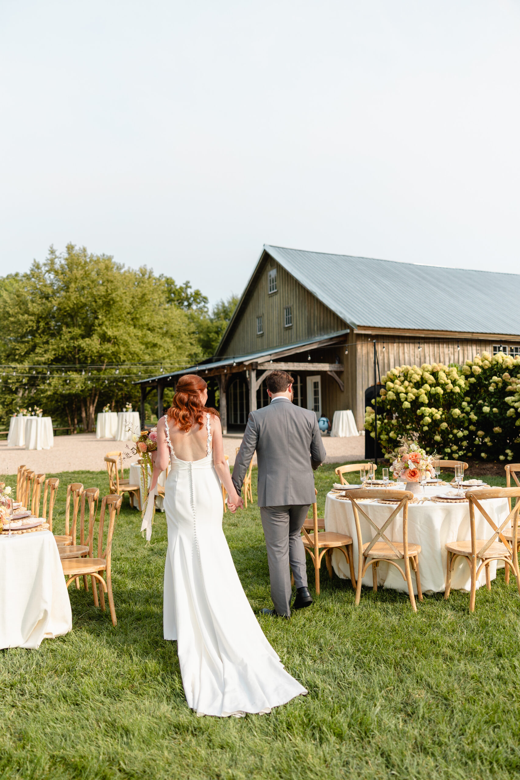 Couple walking through their reception at their virginia wedding venue