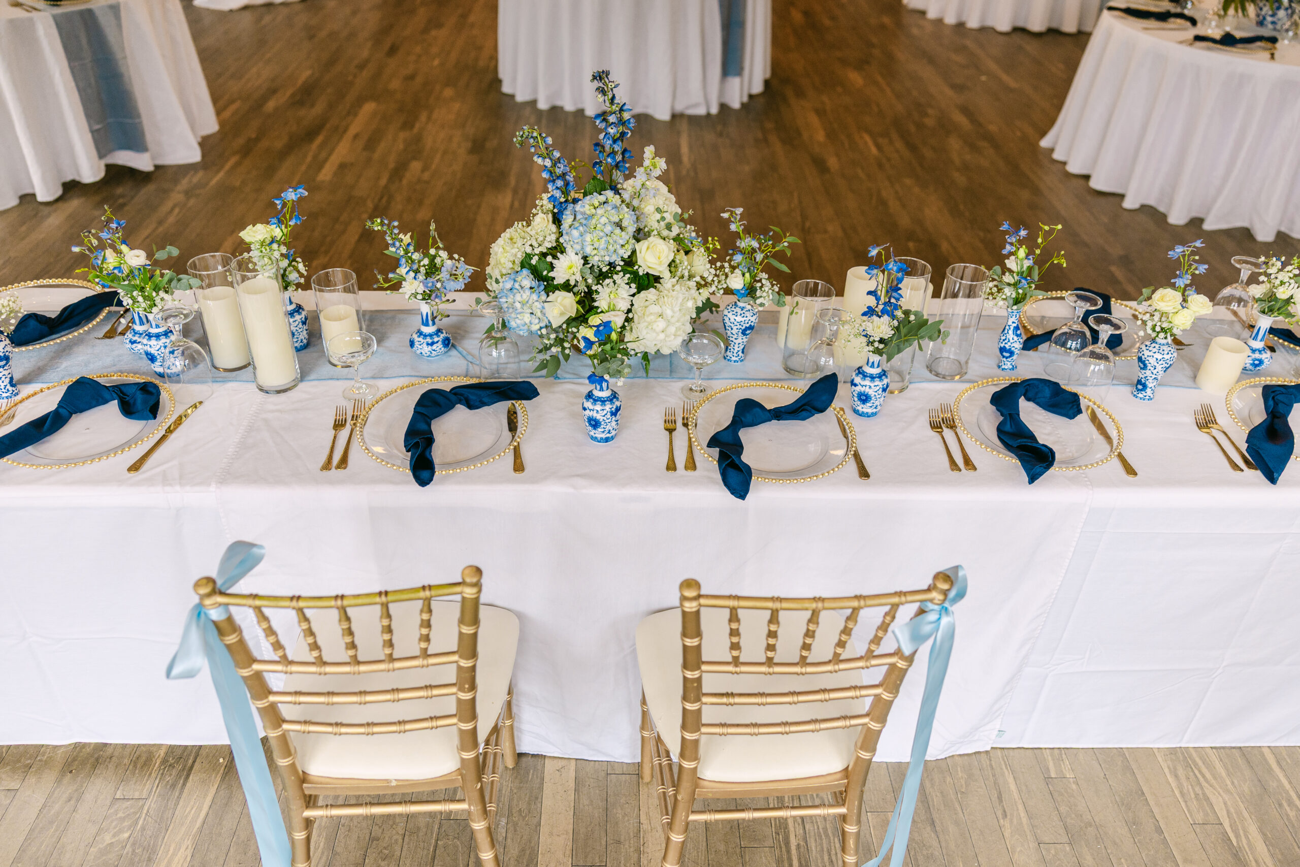 A tablescape from an Emotional Forest Virginia Wedding with lots of Blue China Inspired Decor