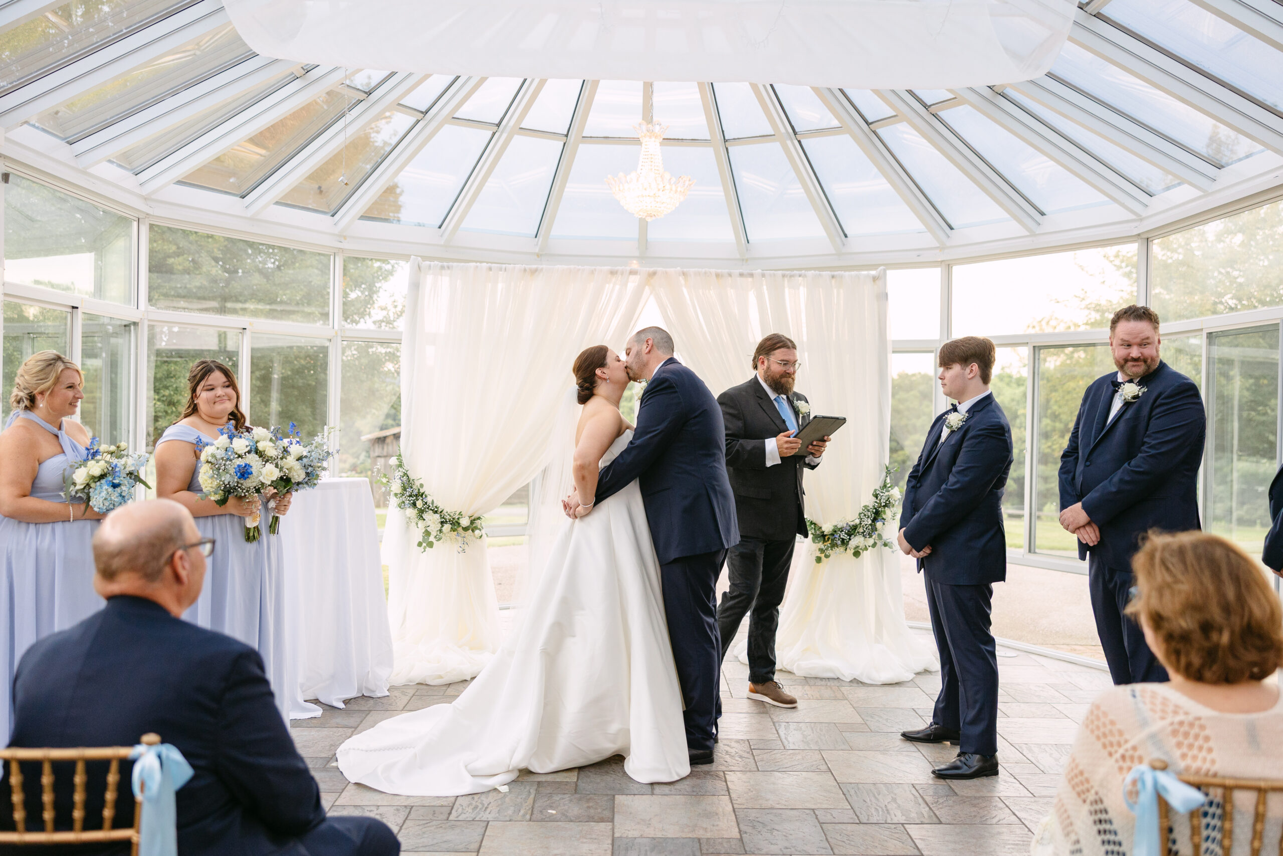 Couple sharing first kiss at the sunroom at West Manor Estate in Forest, Virginia